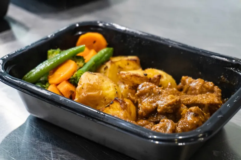 Container of freshly cooked meal