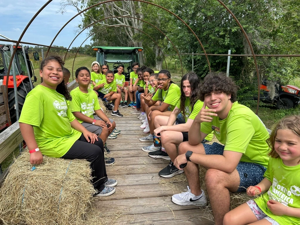Group of kids on a hay ride.