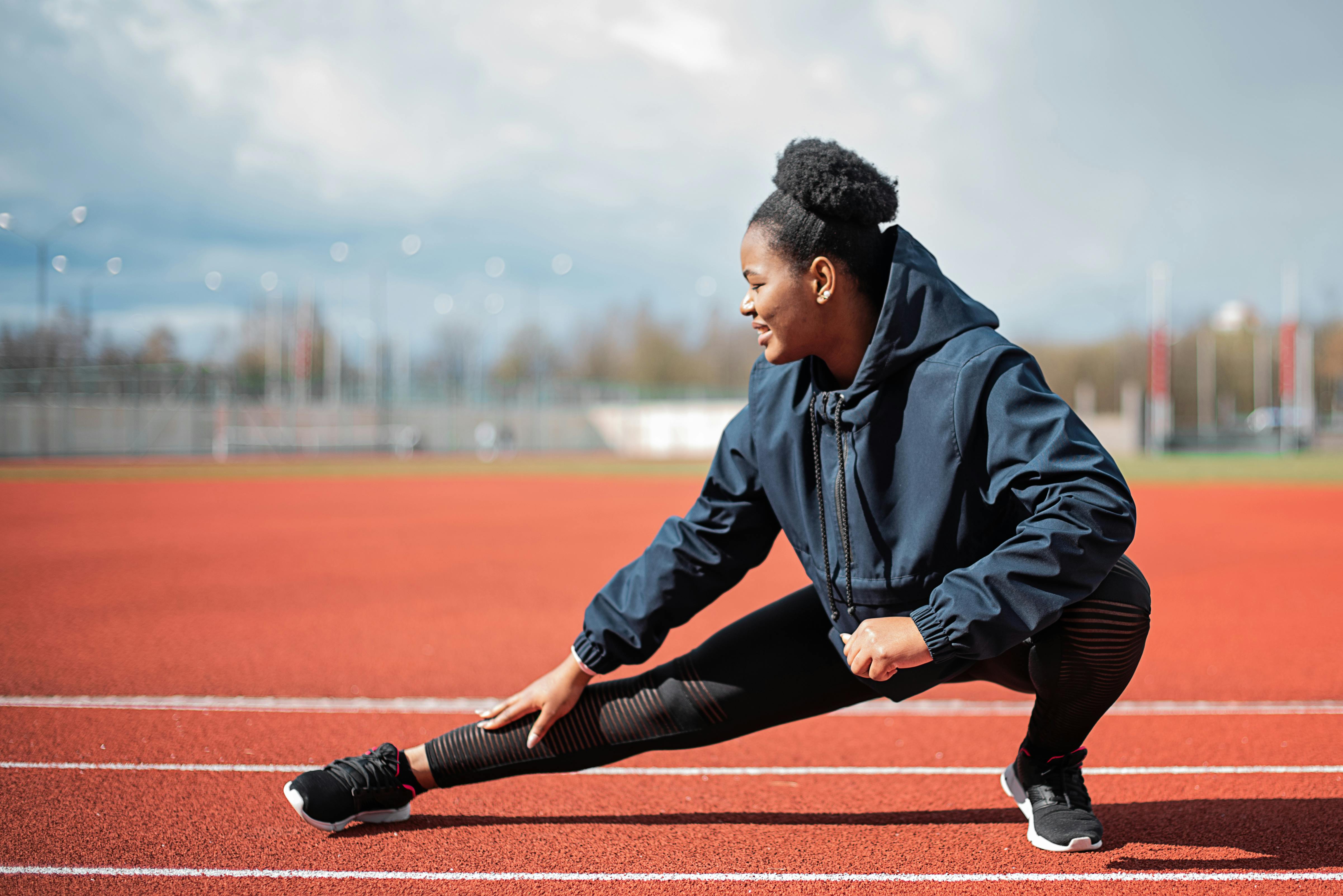 Athlete resting on a running track