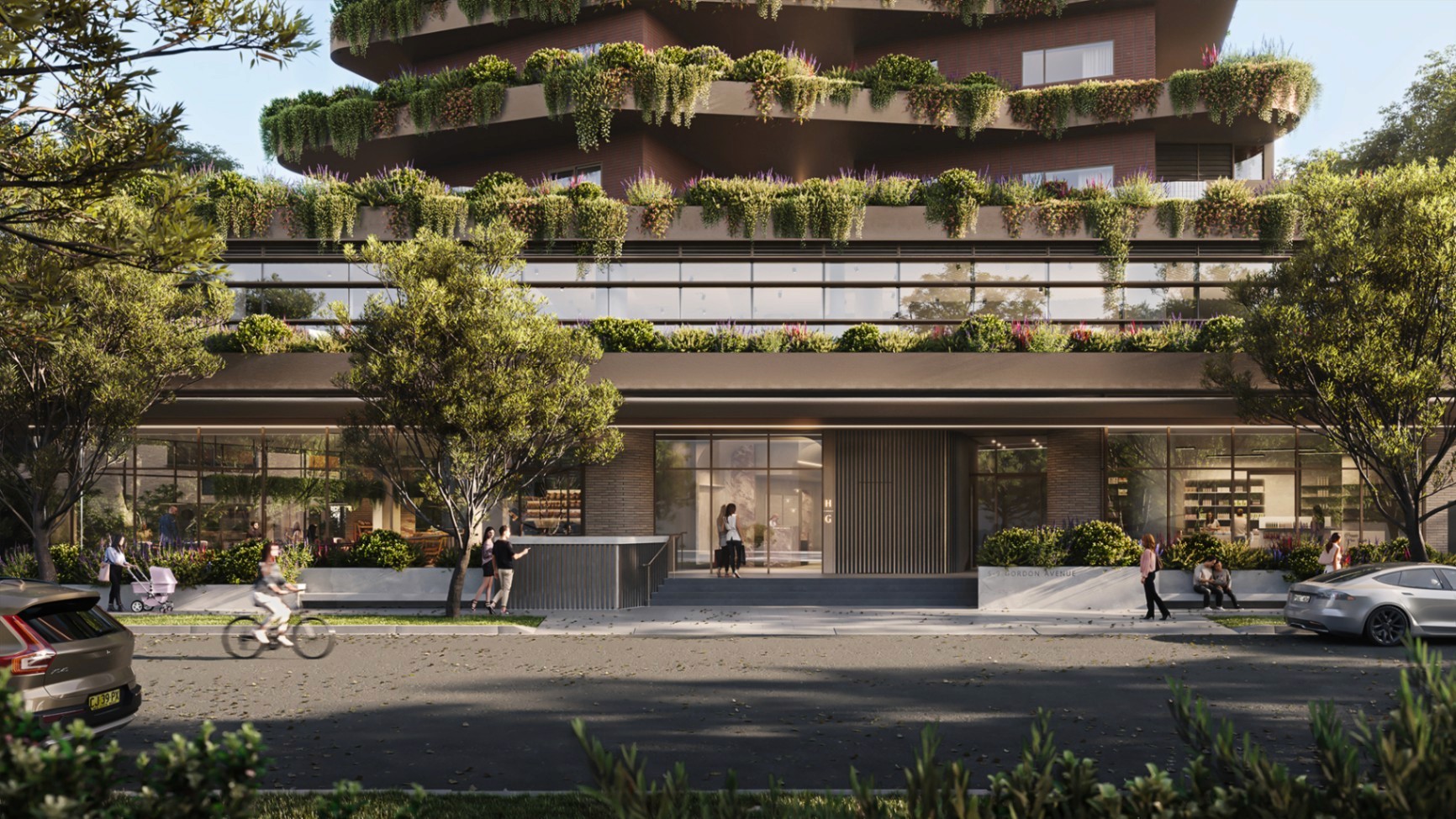 Street-level view of Hammond Greens Chatswood featuring lush landscaped terraces, retail frontage and a modern residential entrance.