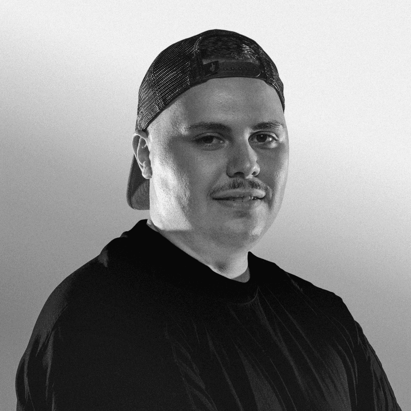 smiling man wearing orange zip-up jacket