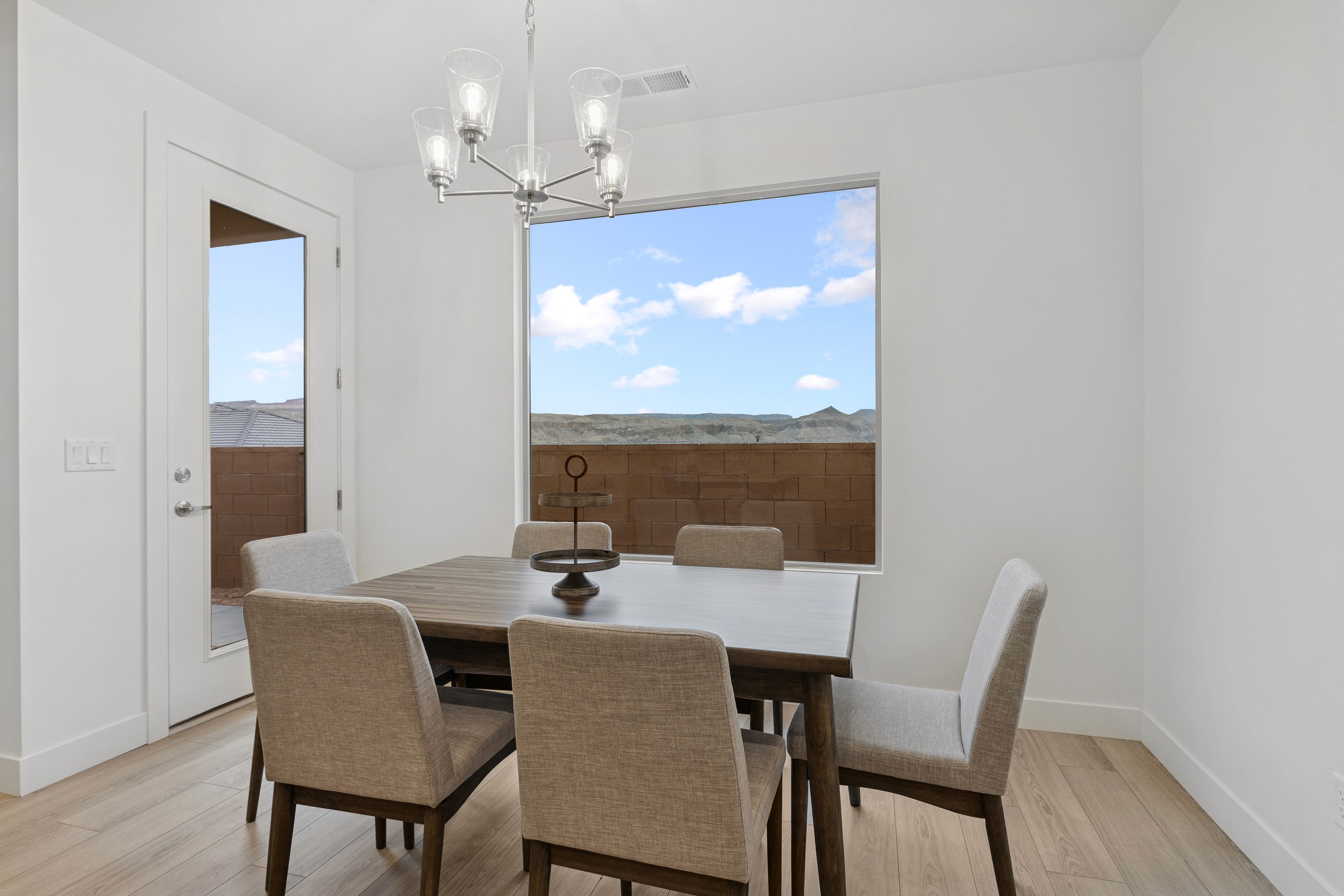 Dining area in The High Desert Home in Hurricane Utah with natural light and modern finishes.