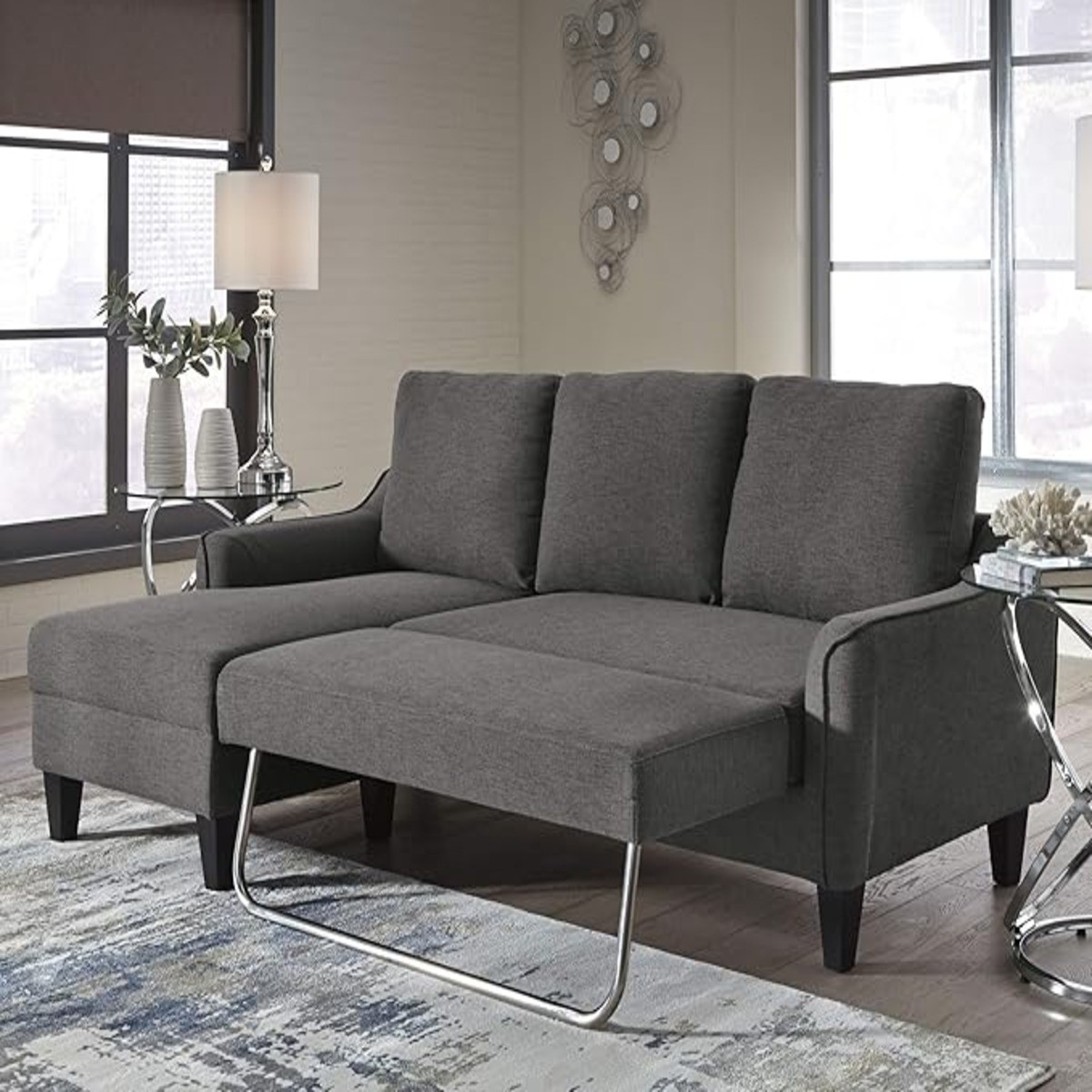 Dark gray sectional sleeper sofa in a modern living room