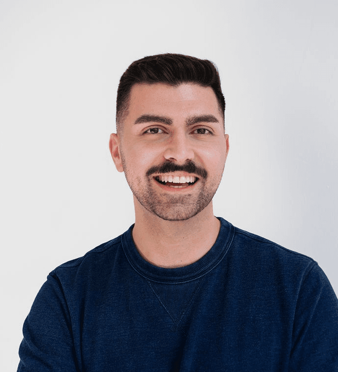 man standing beside wall
