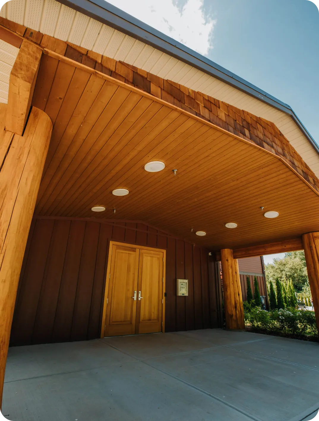 Covered patio overlooking a landscaped property