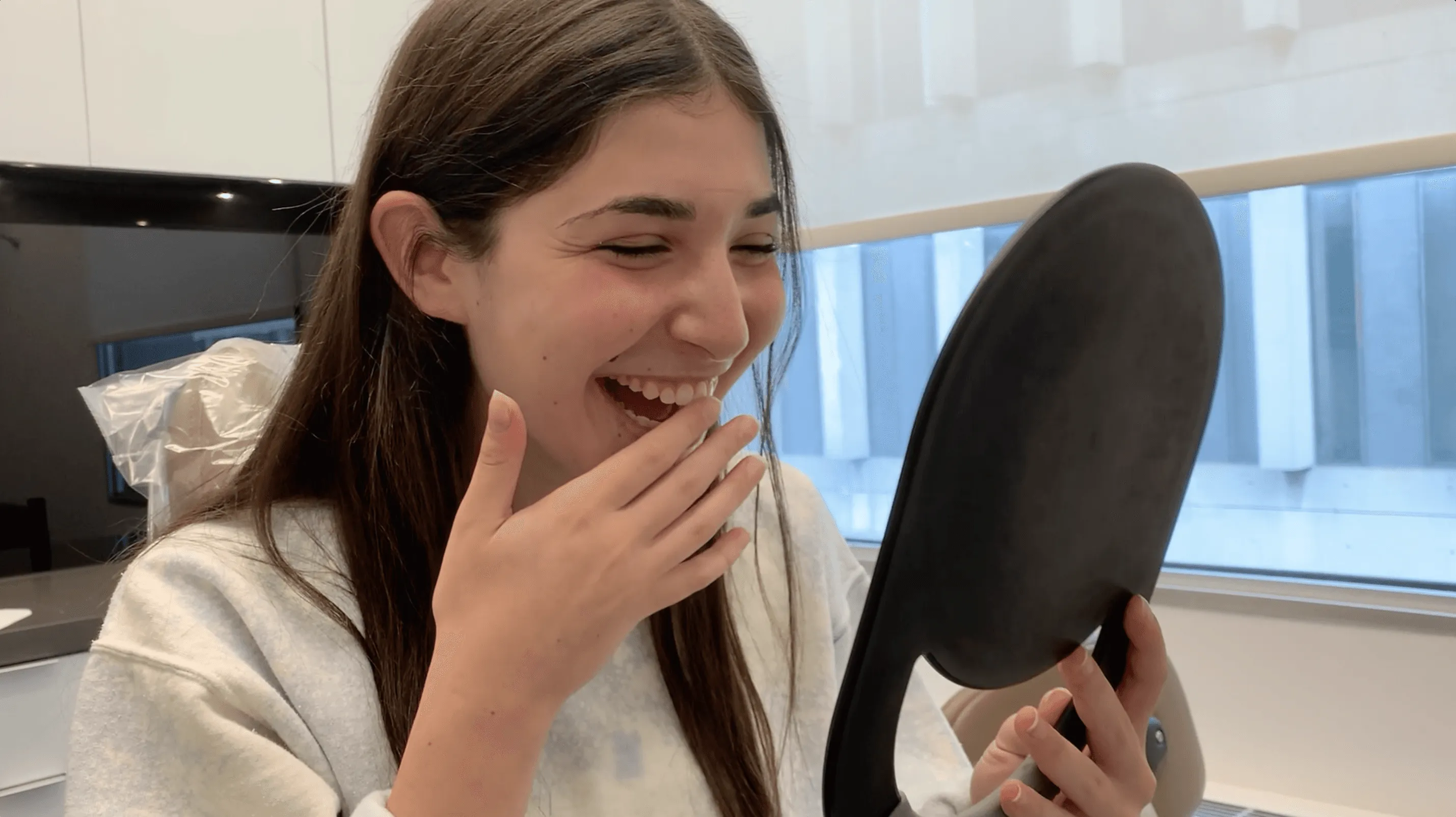 Female Patient Smiling at her Results After Orthodontic Treatment at Midtown Orthodontics | Best Orthodontist in Midtown Toronto, ON