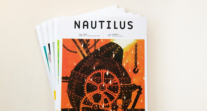 A collection of stacked magazines with the title Nautilus. On the top magazine there is an orange drawing of a furnace with cogwheels, chains and hooks around it.