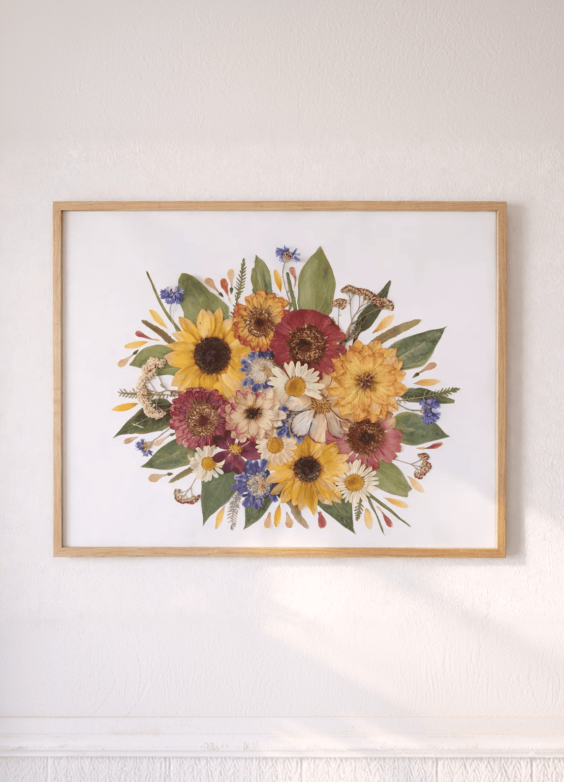 gepresste blumen in einem bilderrahmen