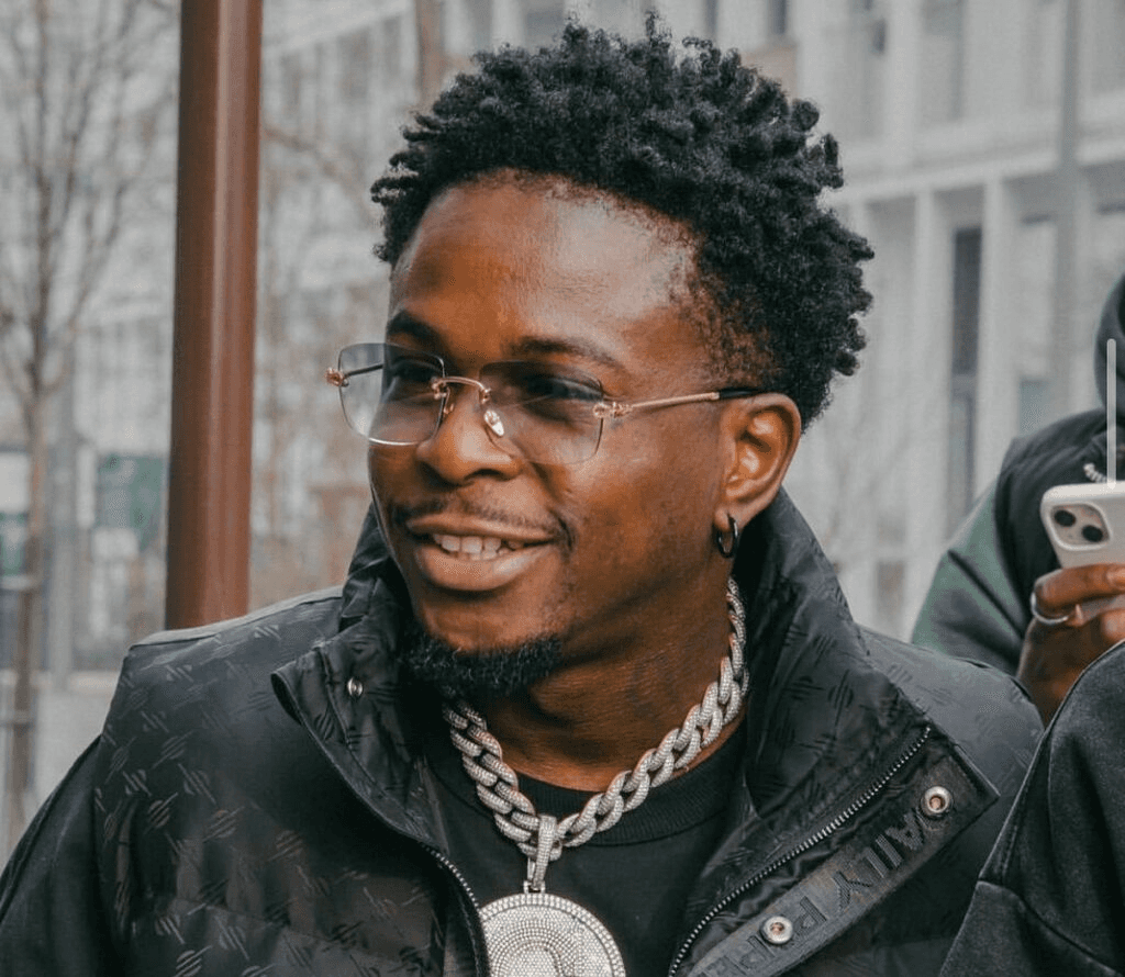 Smiling woman in navy blazer.