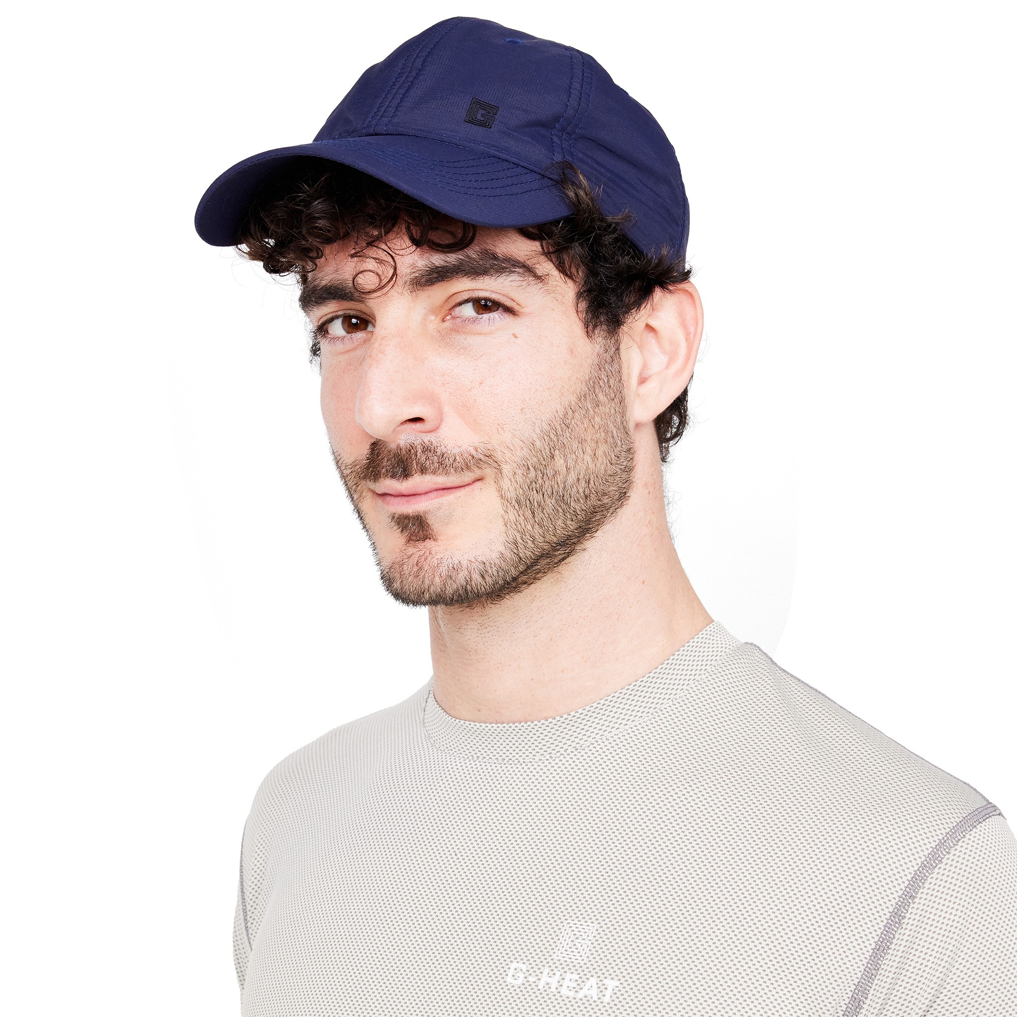 Man wearing a refreshing G-Heat navy blue cap with evaporative cooling technology