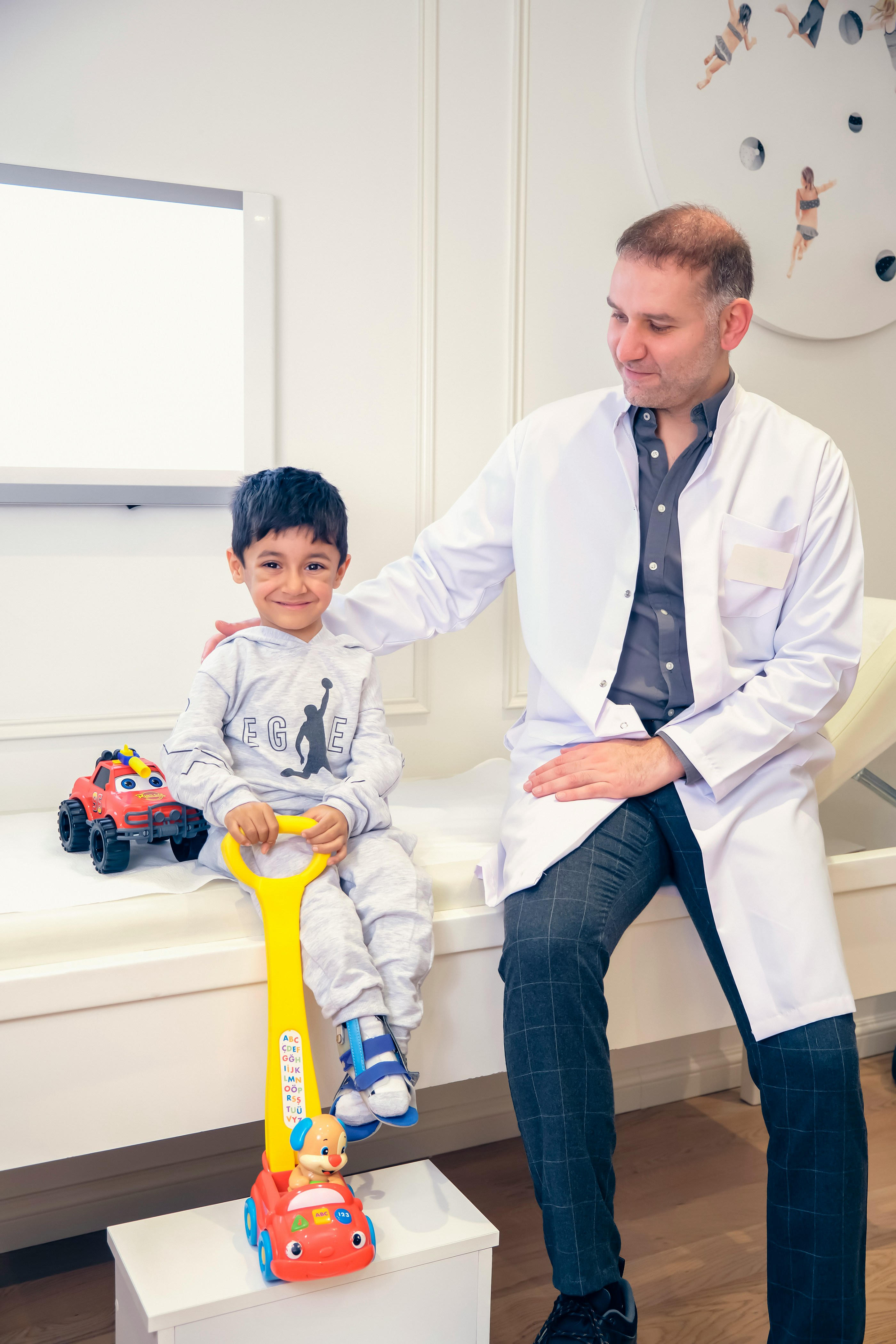 A doctor and patient in an exam room.