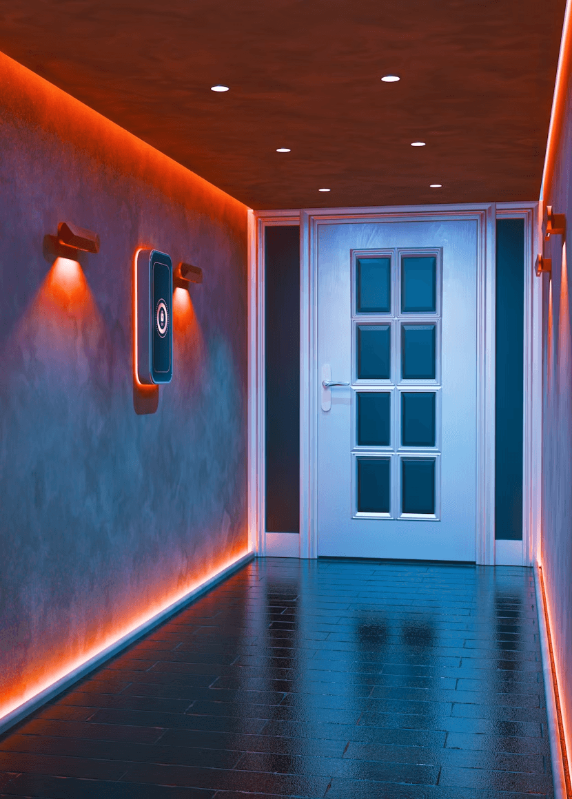 Modern hallway with orange lights and white door.