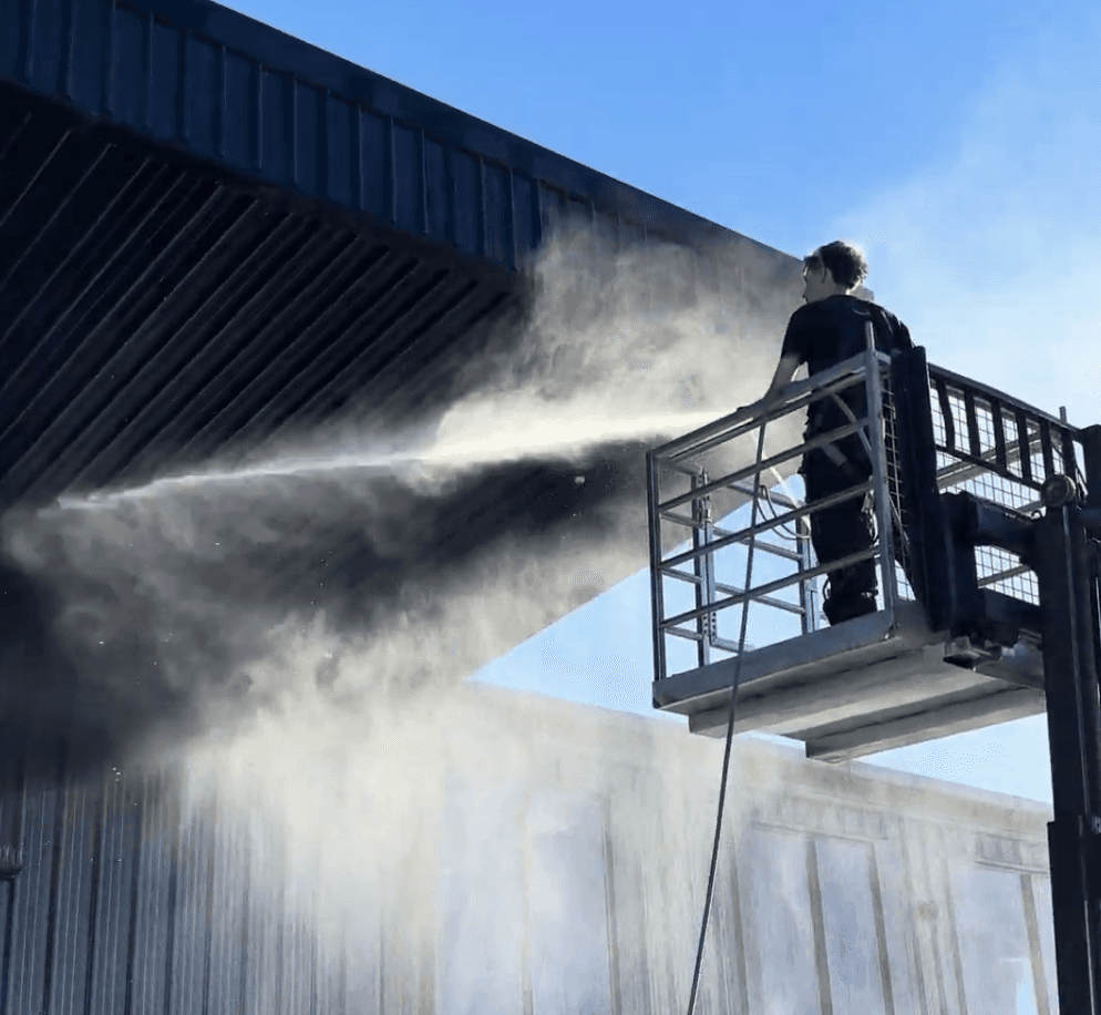 Professional soft washing service on a Hamilton warehouse exterior by MJ Exterior Cleaning