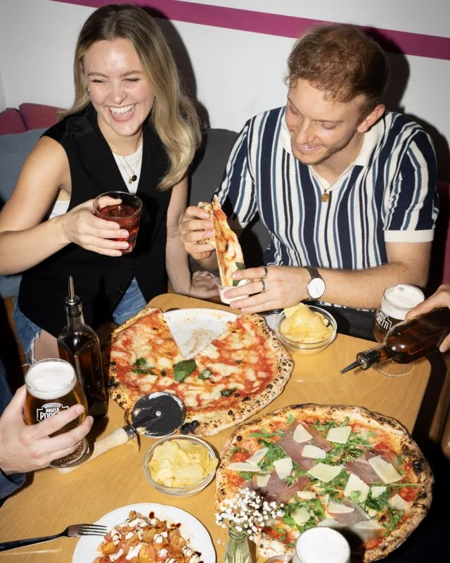 A group of people enjoying Rudy's