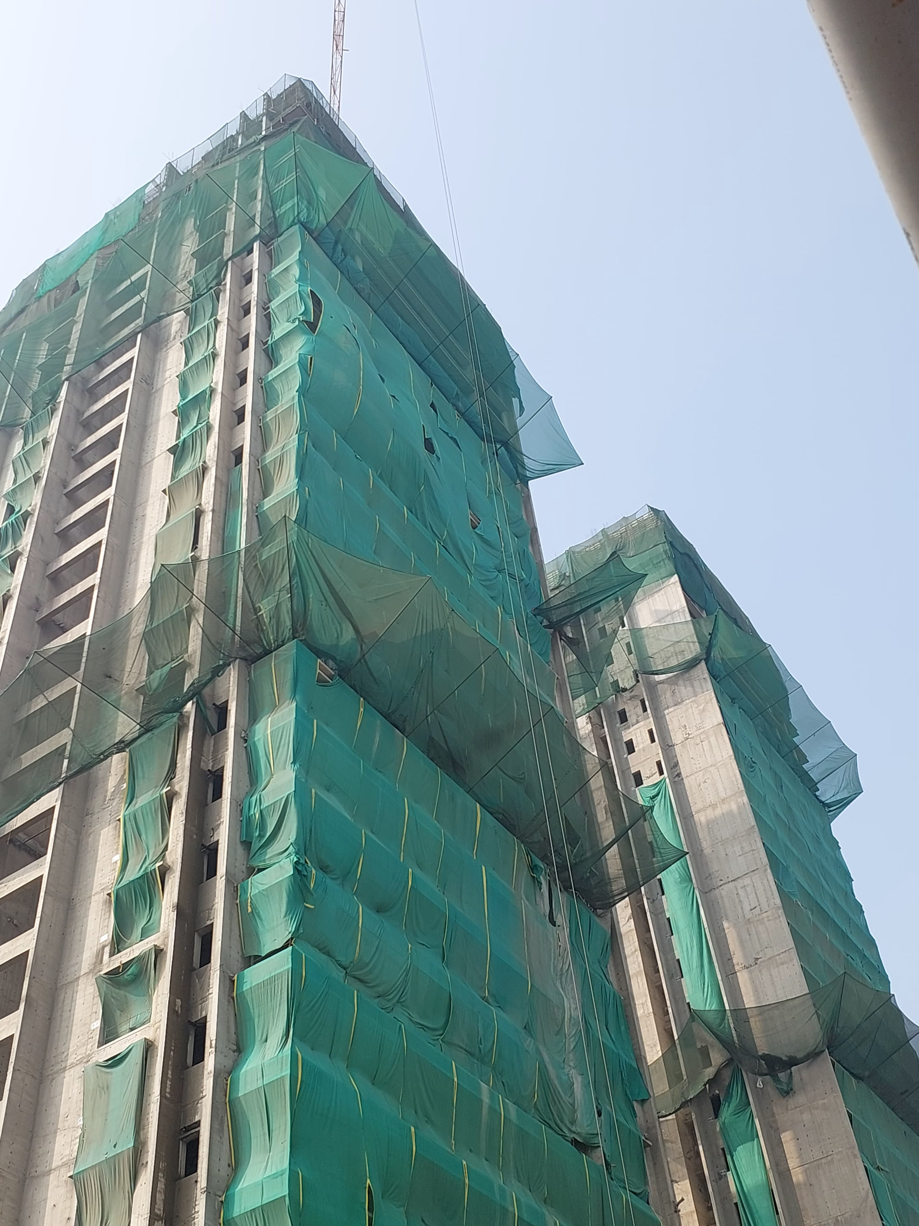 Safety net installation at high-rise construction site in Pune kondhwa