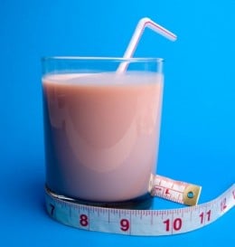 protein drink and measuring tape