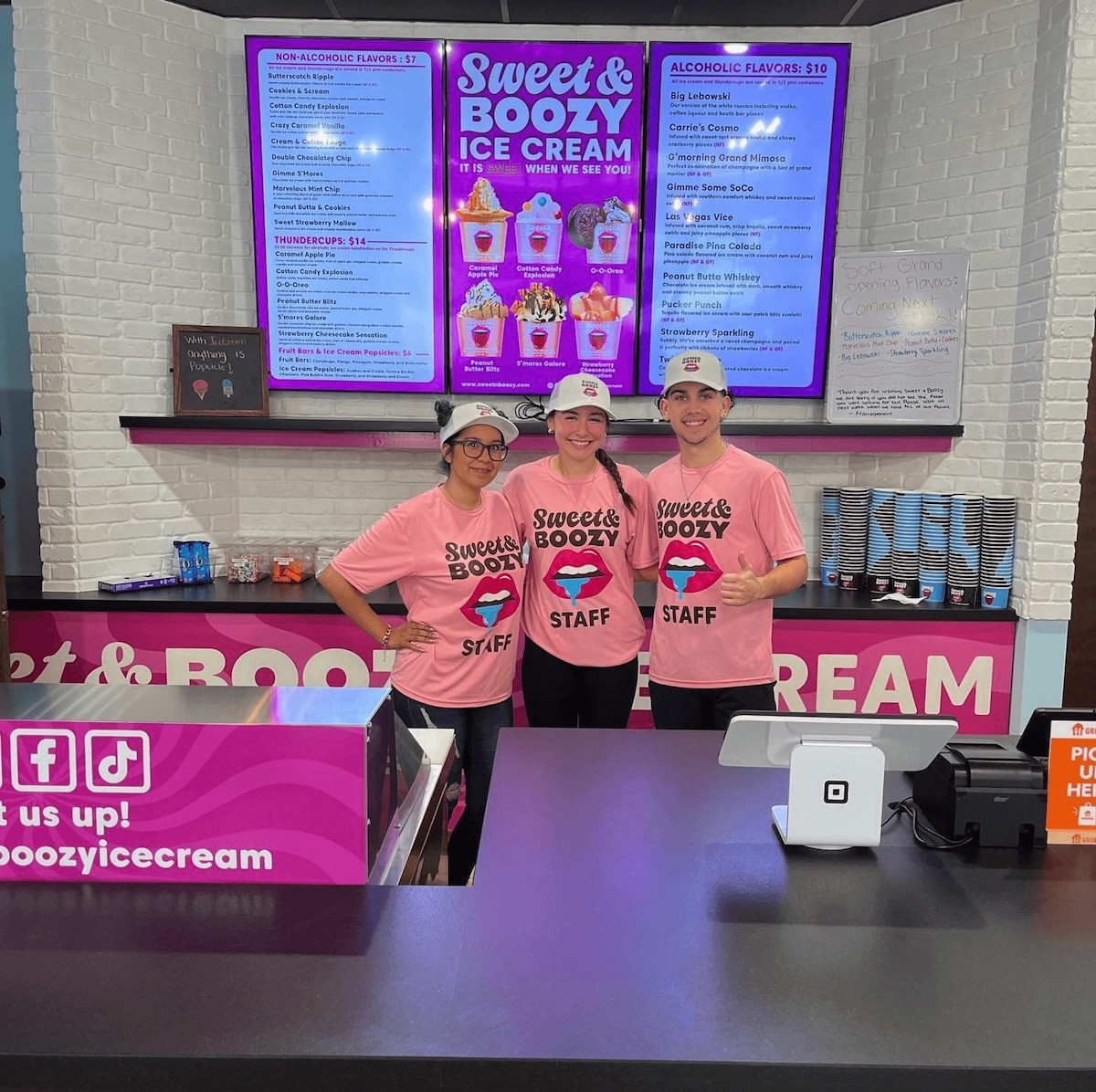 Sweet & Boozy ice cream storefront with big menus and store employees