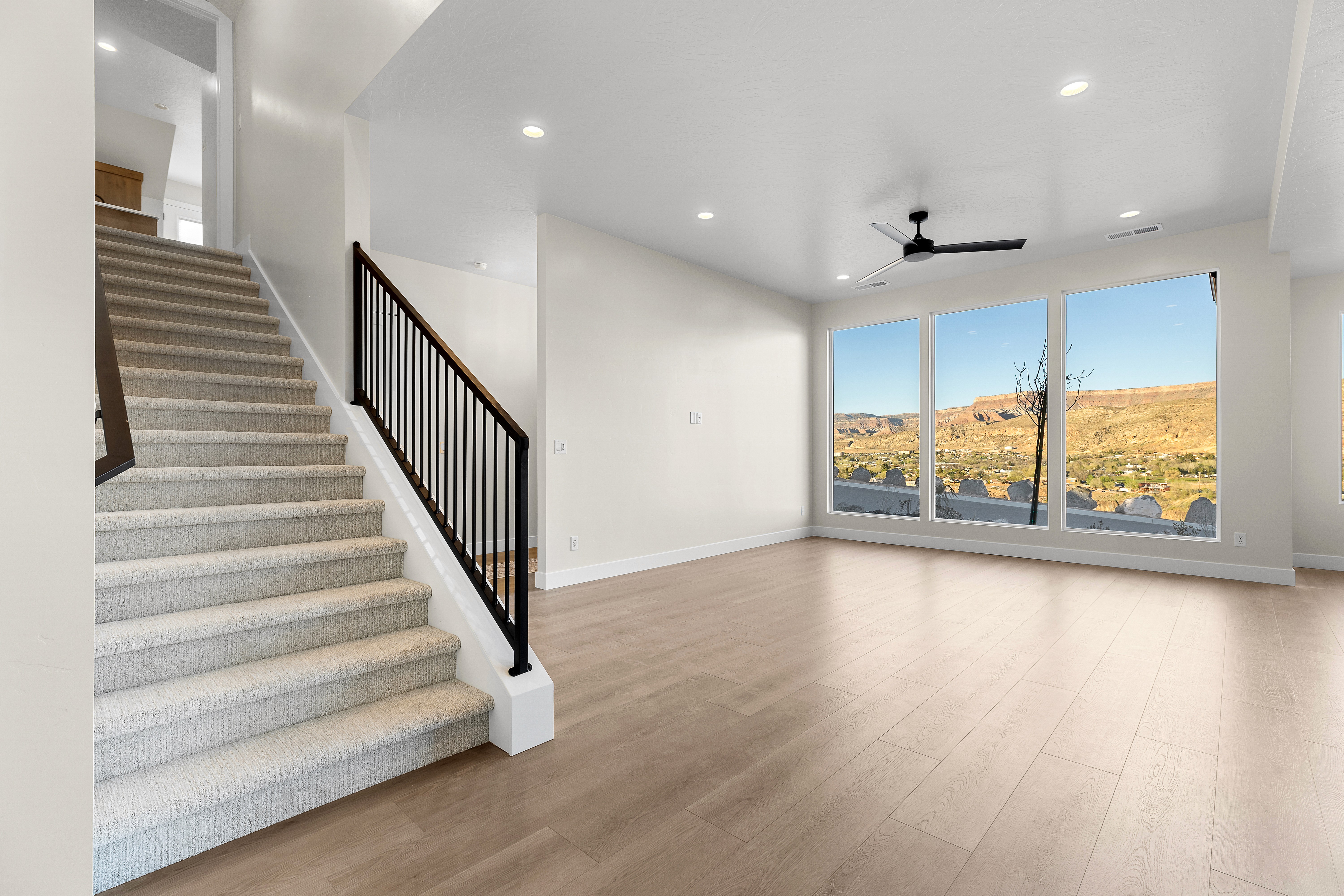 Staircase in a custom home in Hurricane Utah with modern railing and clean design