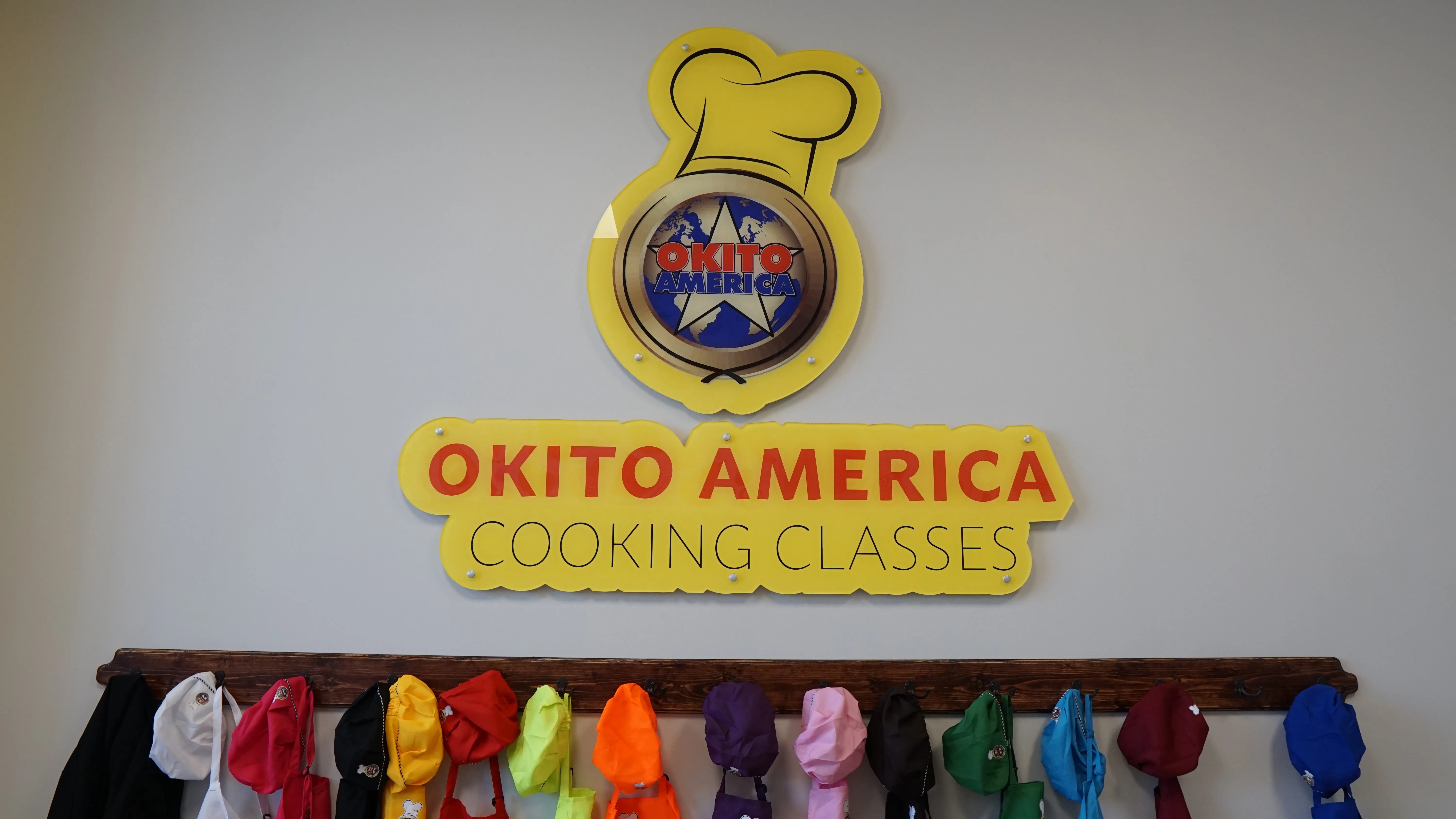 Picture of the cooking class logo with aprons underneath