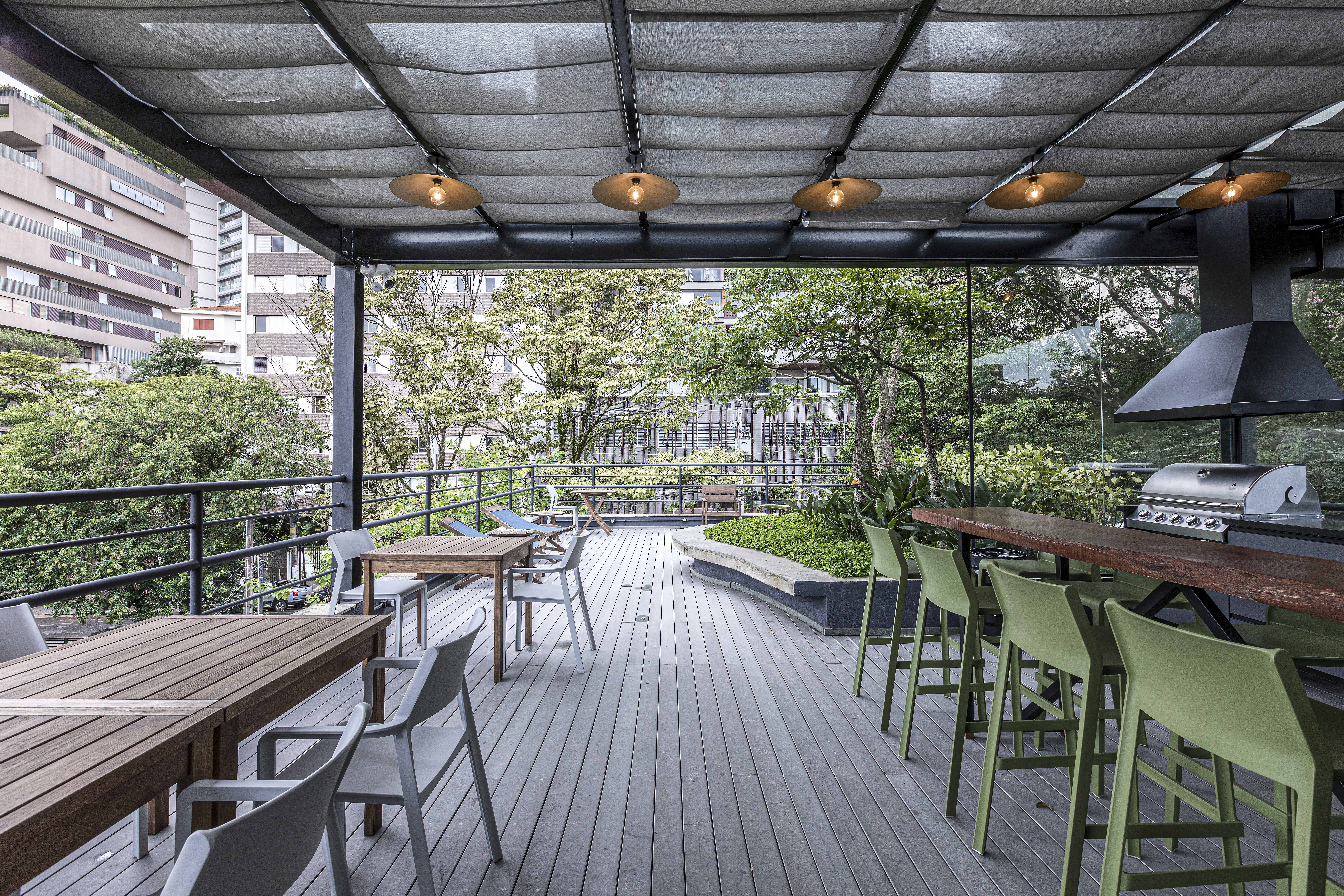 Free Framer Template - A cozy interior of a cafe with wooden tables, chairs, and potted plants, creating a warm atmosphere.