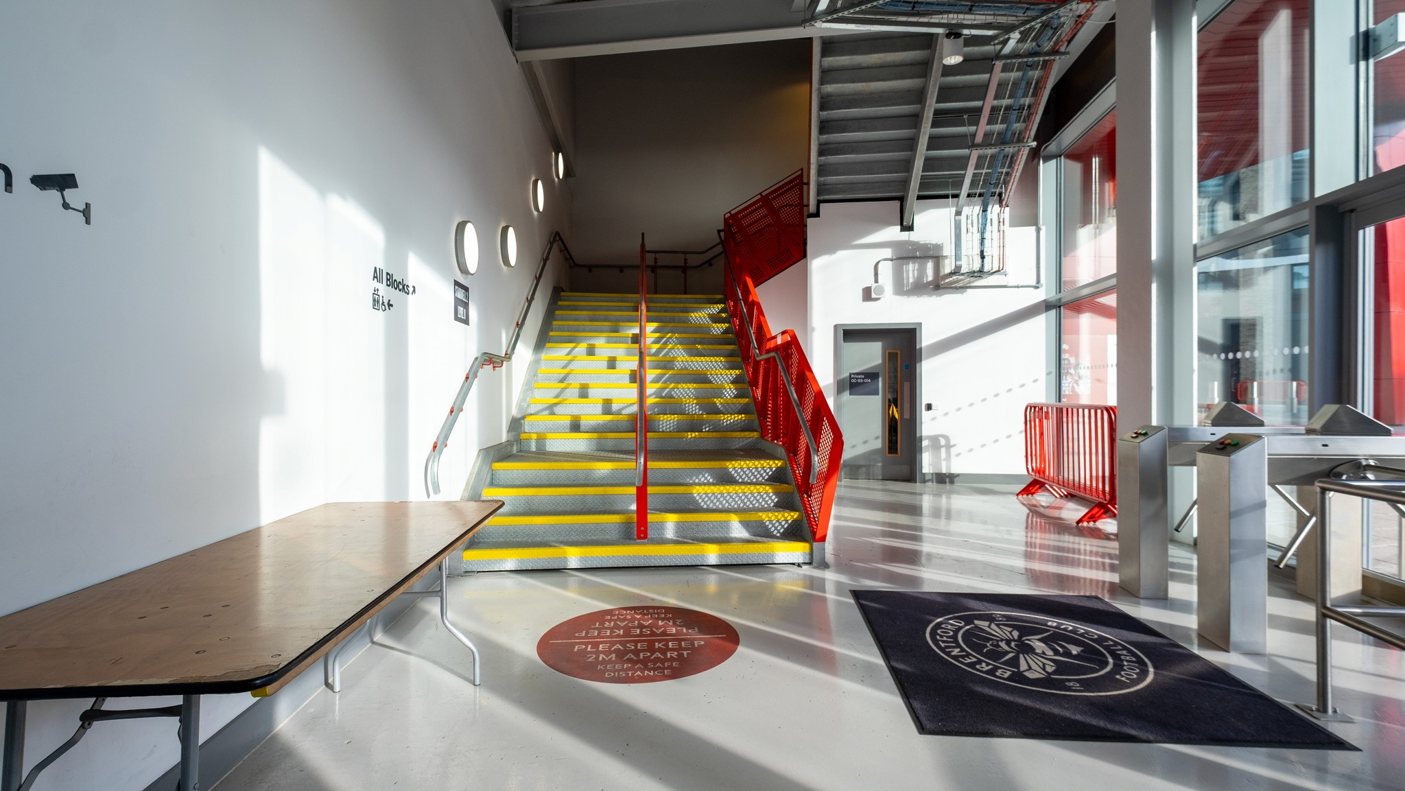 Young woman looking out a window at night