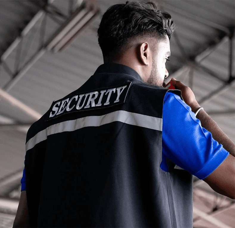 Back view of a security officer on duty, representing property security measures relevant to negligent security claims