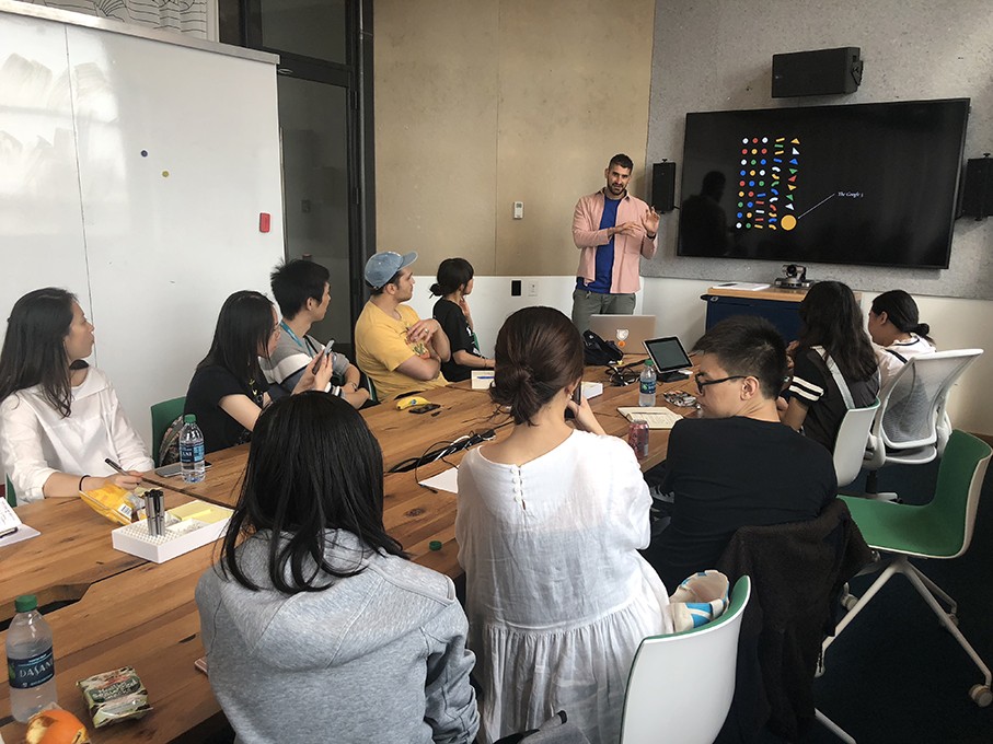 a course class with students and the teacher presenting the design lesson