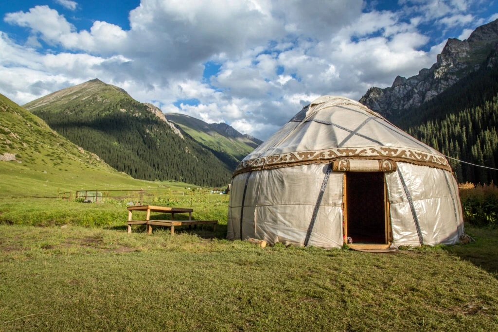 Traditional yurt in mountain valley
