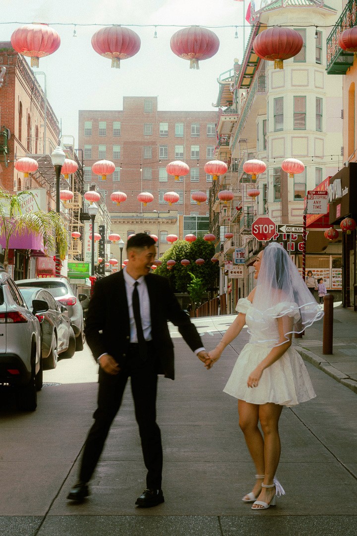 man in gray suit and woman in white wedding dress