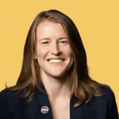 man wearing green crew-neck top and eyeglasses with black frames looking at side