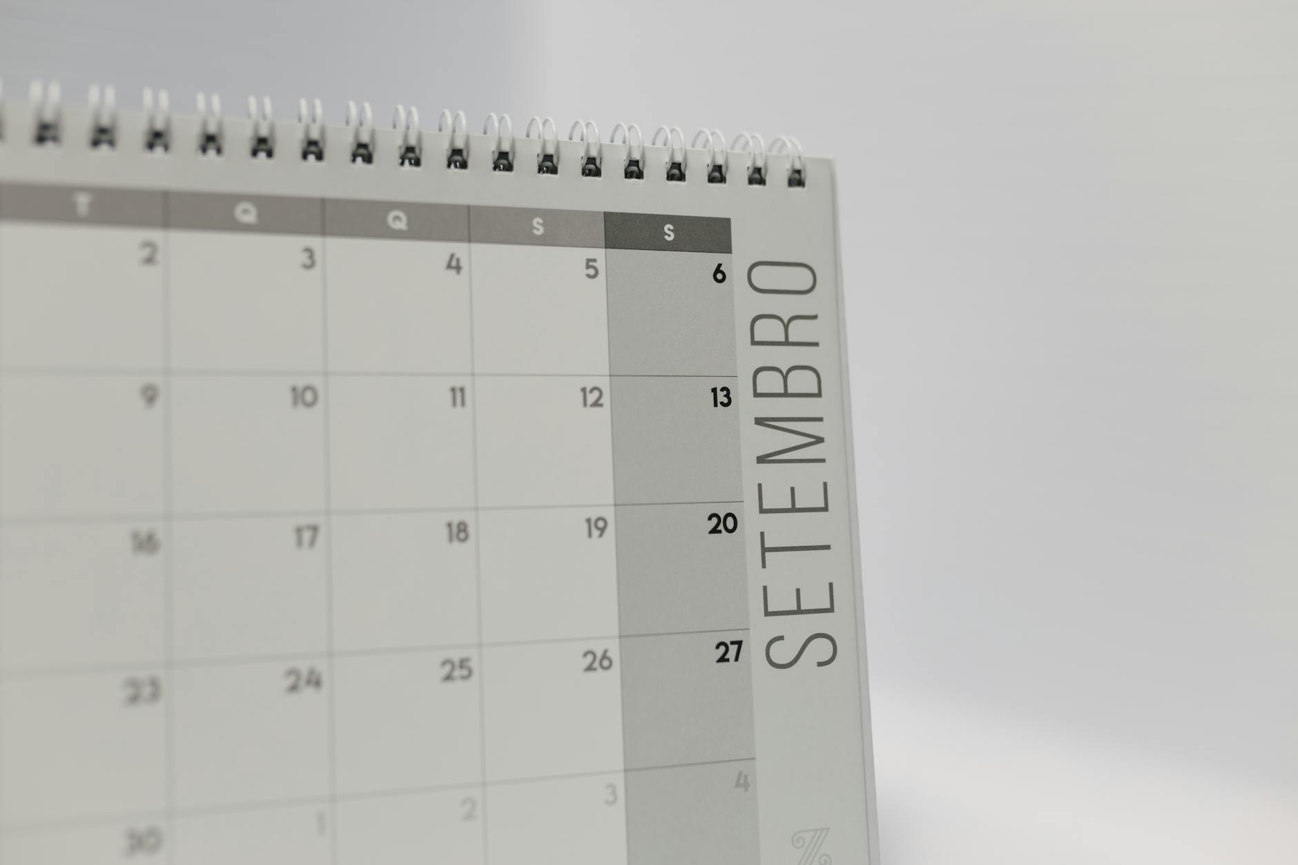 A colorful wall-mounted monthly calendar with specific dates circled for upcoming student data collection sessions.