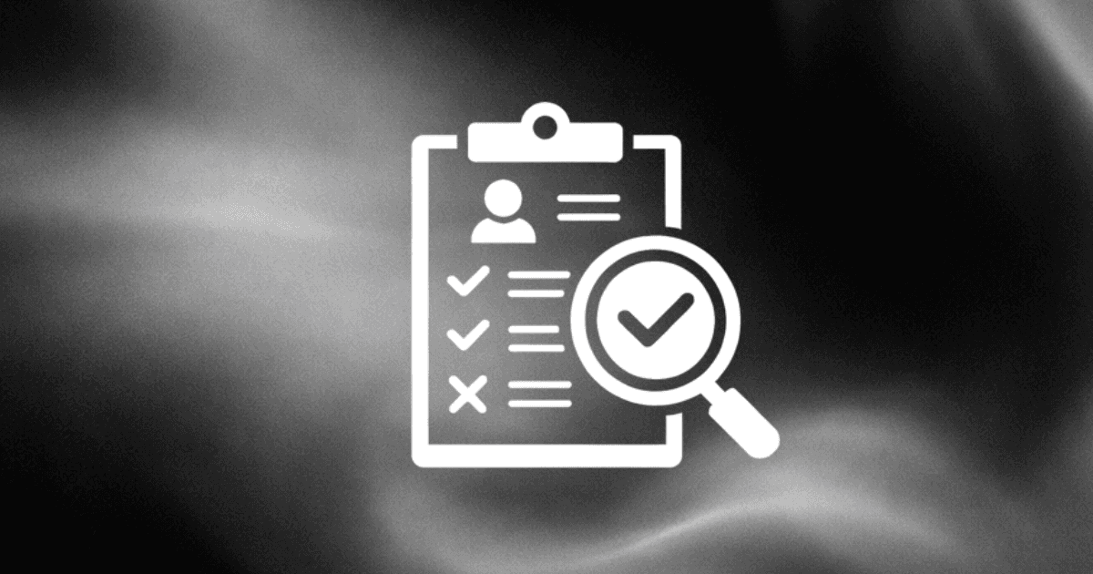 person using macbook air on white table