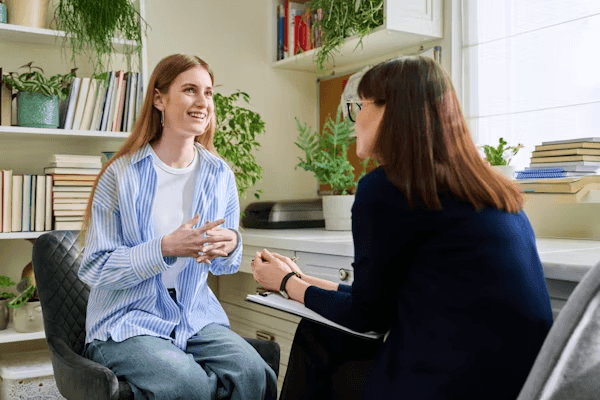 High school student conducting psychology research with a PhD mentor in a one-on-one session