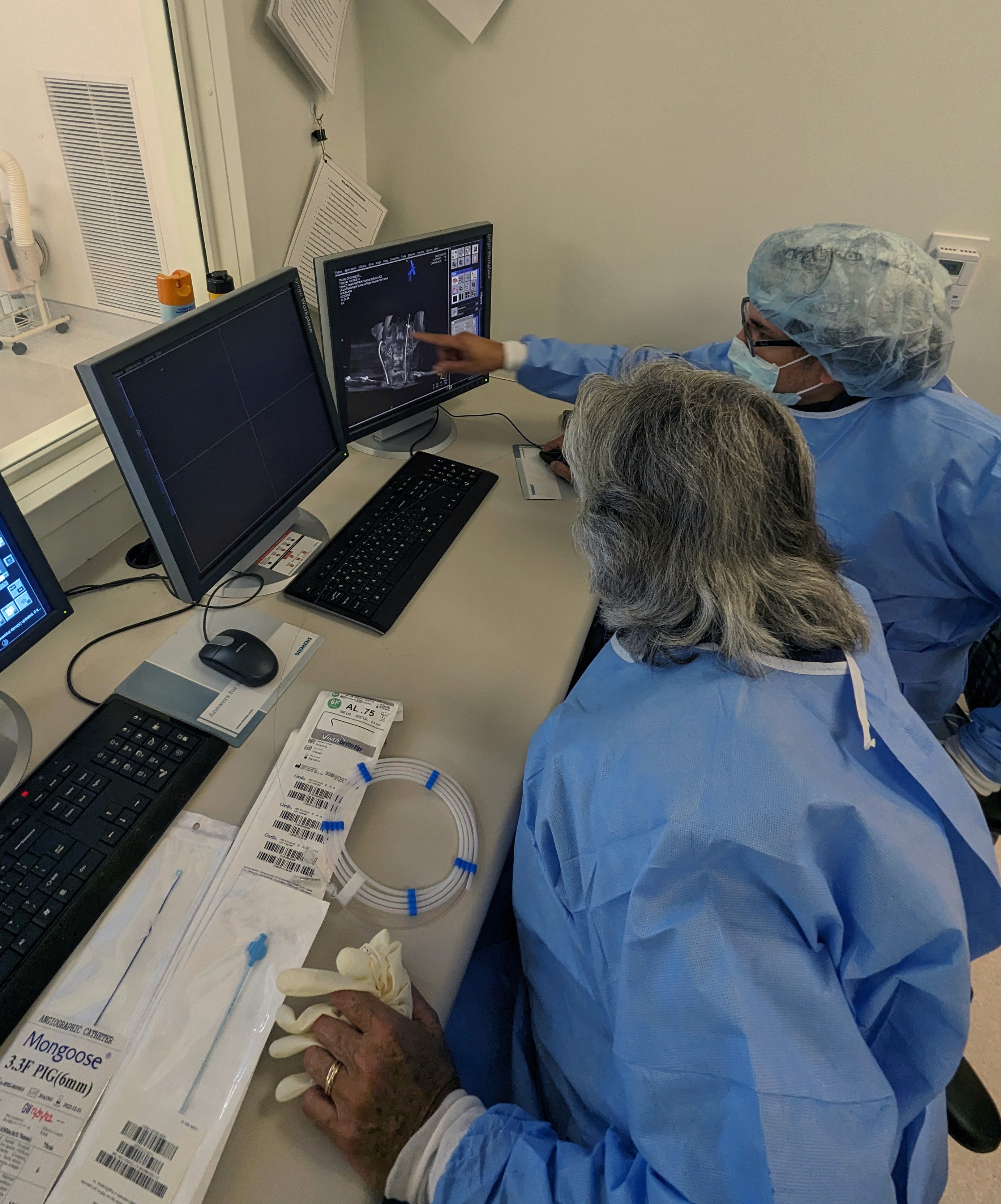 CMO Dr. Jose Morales and Dr. Gary Duckwiler working in a lab.