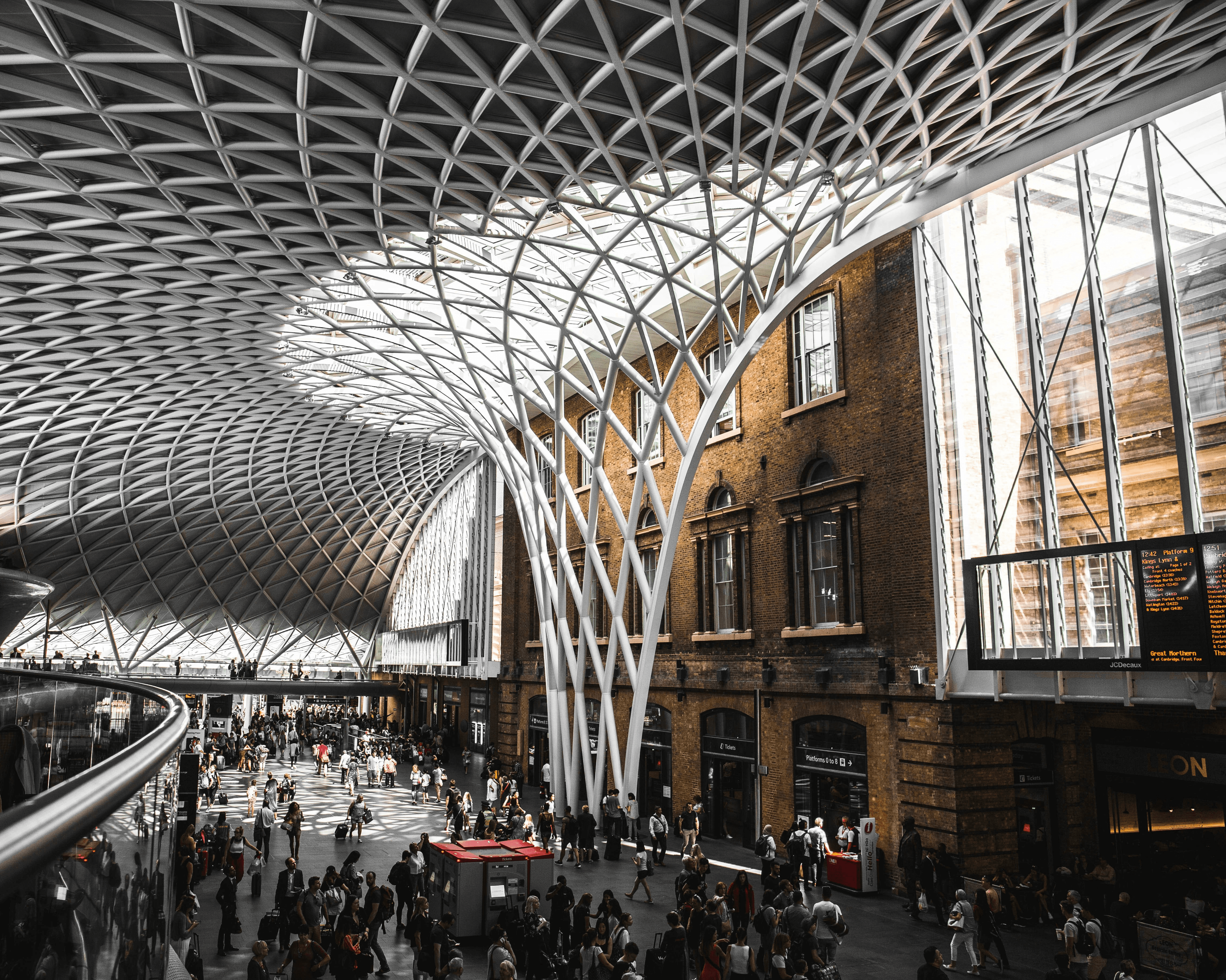 Free Framer Template - A modern building with a sleek, curved glass facade against a blue sky.