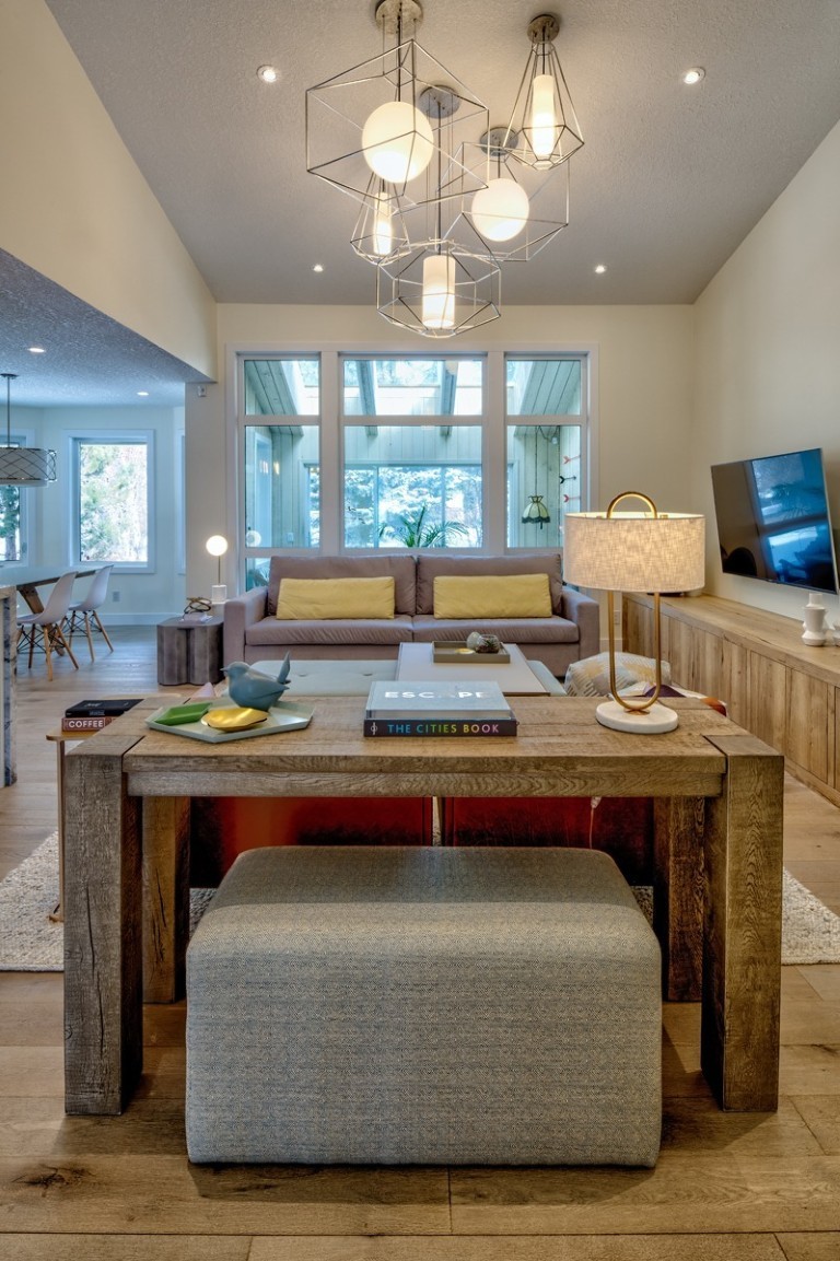 Image of Luxury home interior design by KHD Homes featuring furniture, layout design, and modern lighting fixtures.