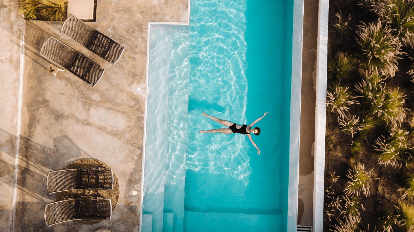Drone Shot Woman in Swimming Pool