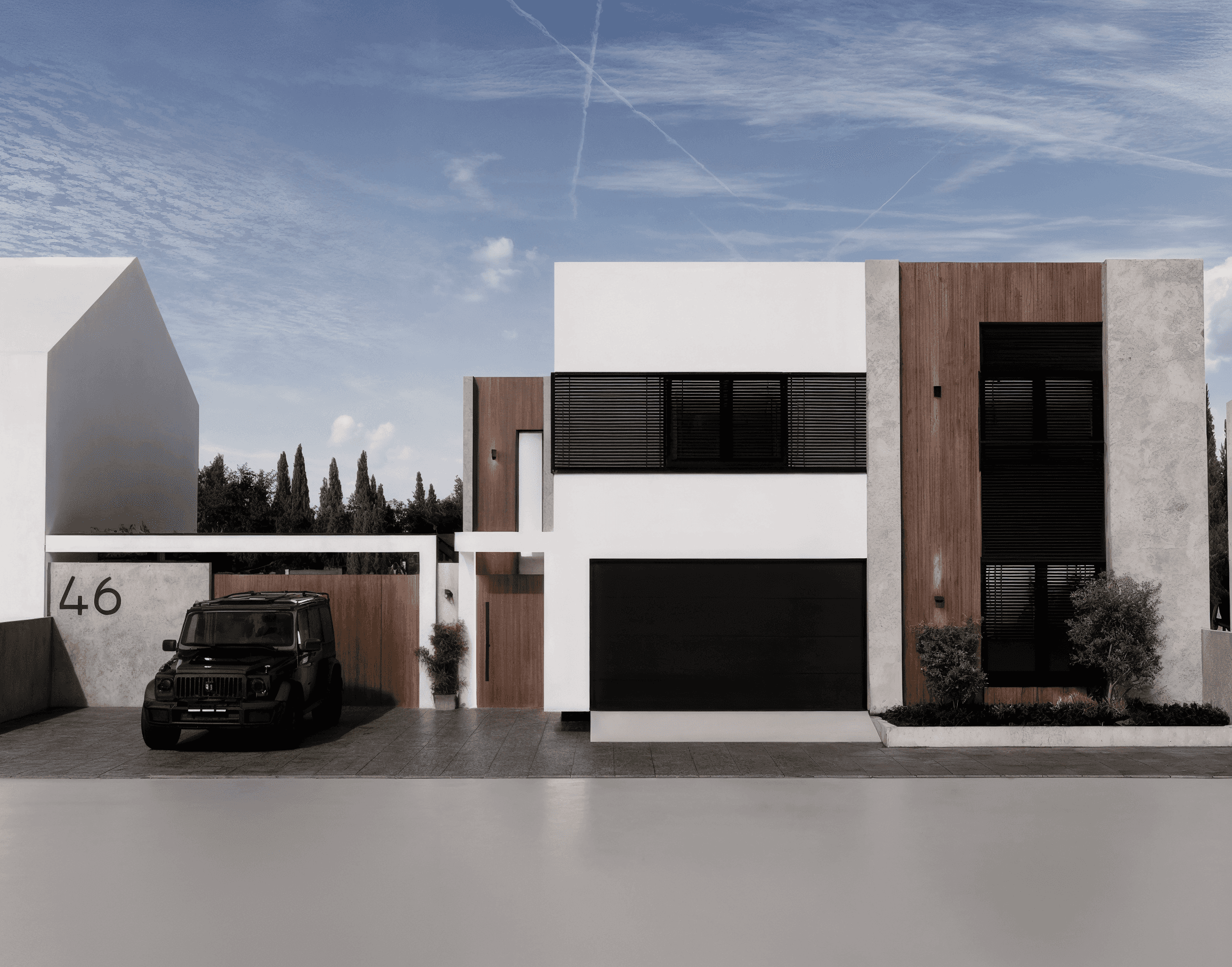 Modern timber-clad residence with horizontal wood facade and geometric volumes set on manicured lawn