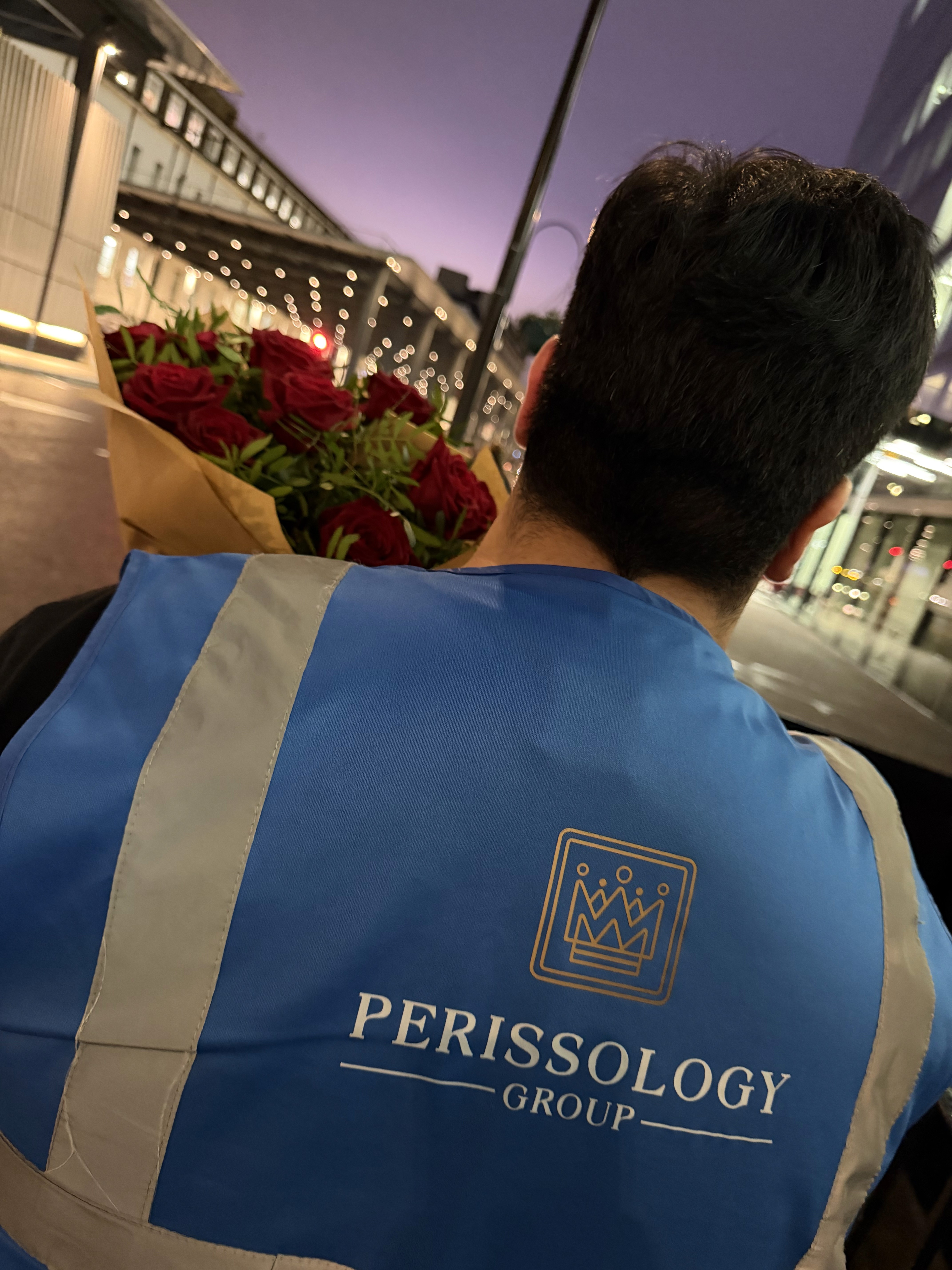 Perissology Courier delivering roses
