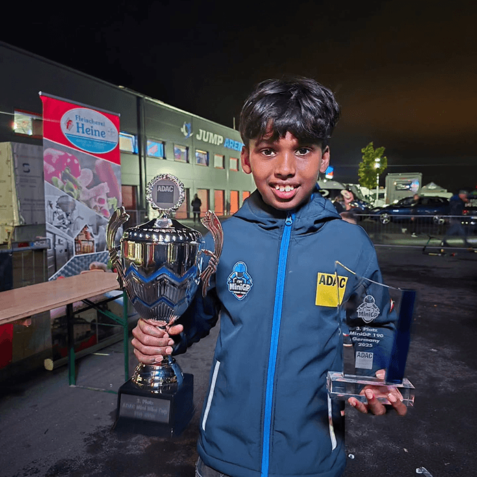Jaden Immanuel holding a trophy in the ADAC MiniGP championship