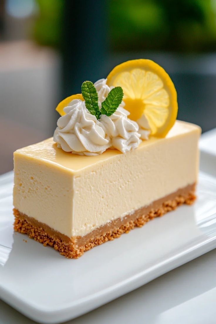 Limoncello Cheesecake from PASTA 9 Toronto, creamy lemon liqueur dessert topped with whipped cream and zest for a refreshing finish.