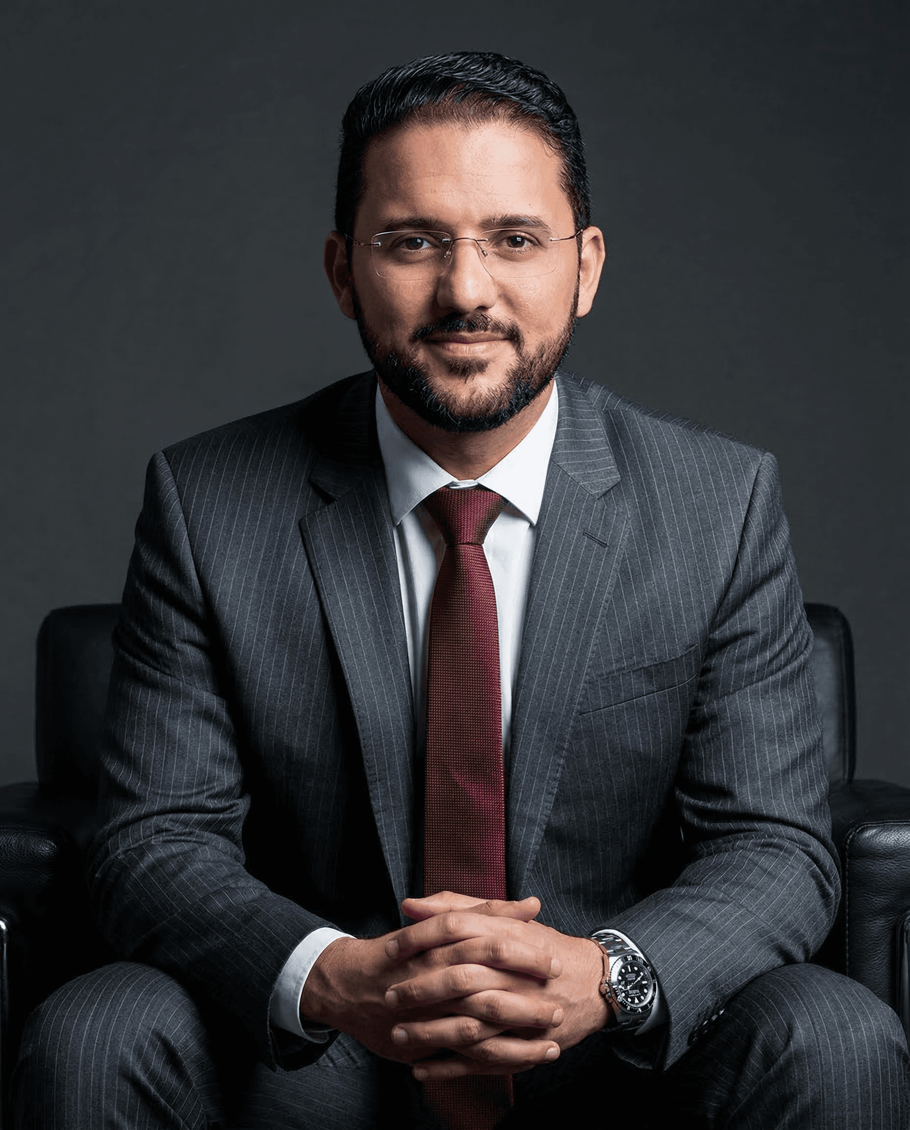 A woman in a business suit standing with her arms crossed