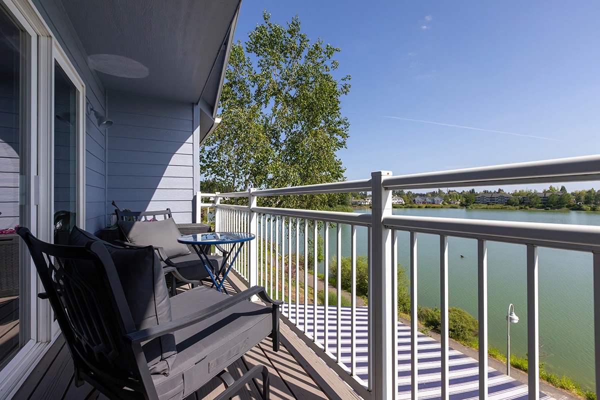 Relaxing balcony scene overlooking lake, light and shadow and dramatic geometry