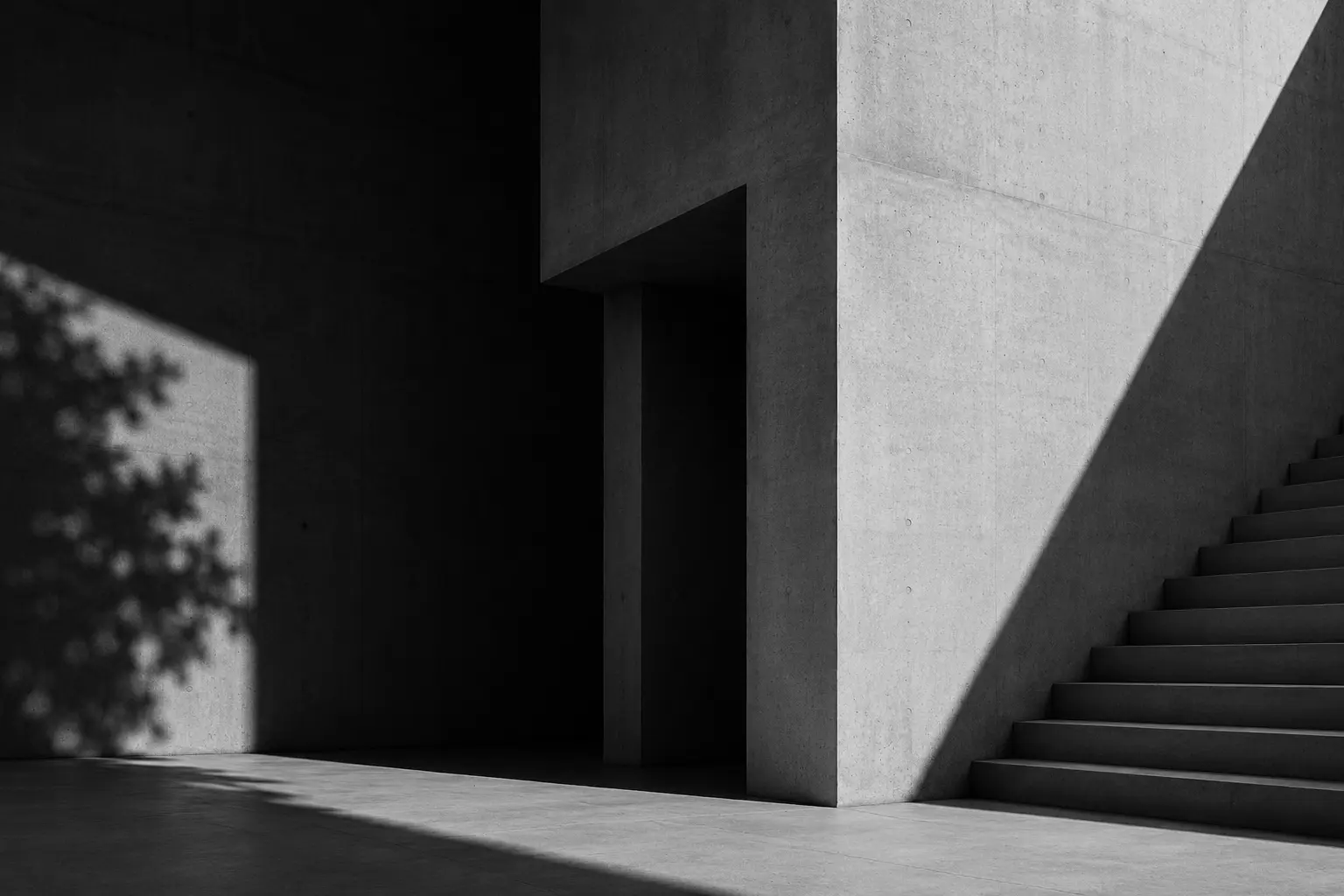 Minimalist concrete architectural space with dramatic light and shadow symbolizing clarity, structure, and memorable brand building.