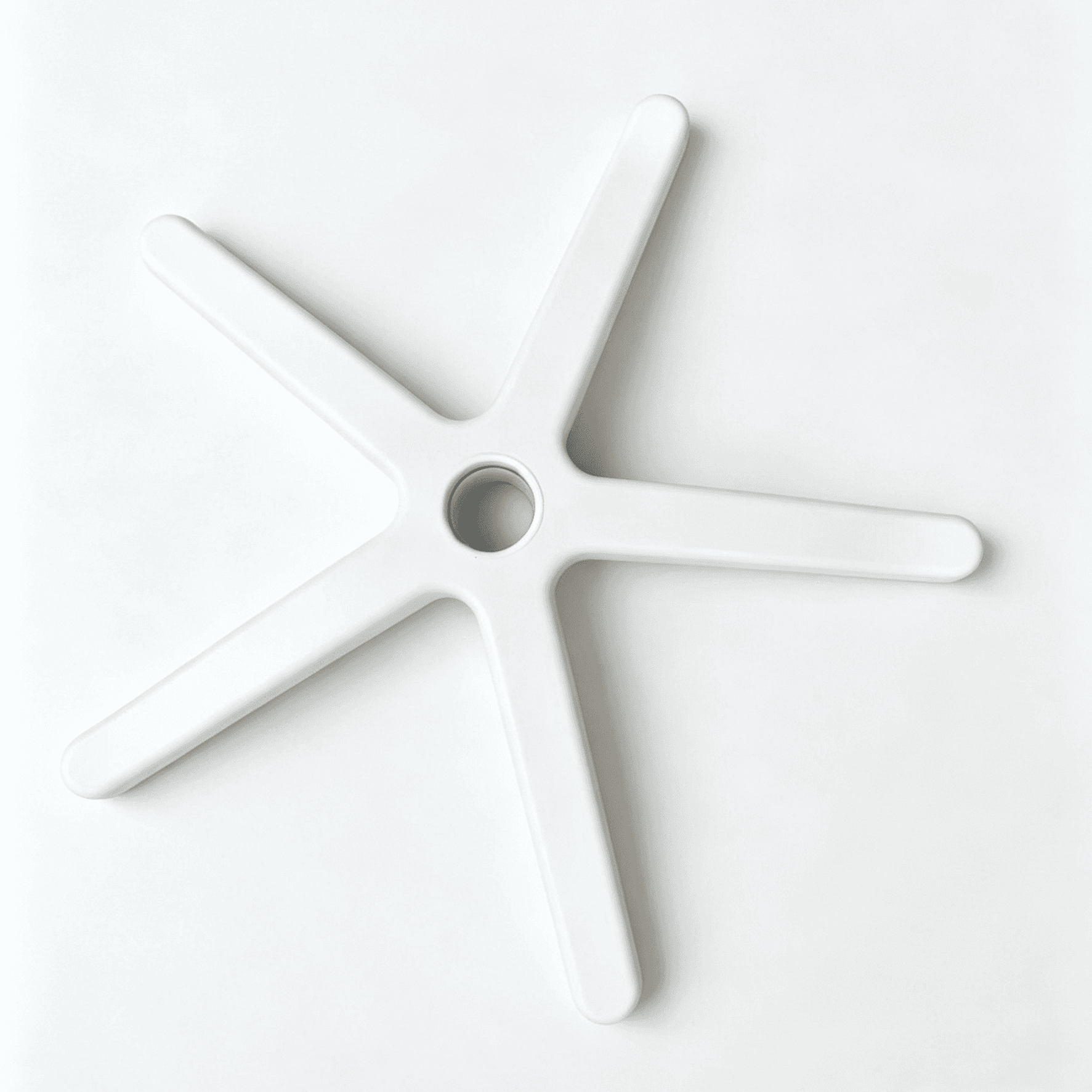 Top-down view of a minimalist white 5-star office chair base with slim, rounded legs and a central mounting hole, isolated on a white background.