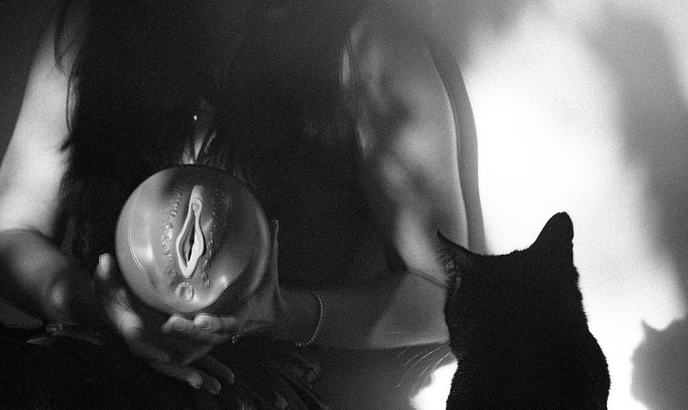 Hands cradling a sculptural form of the female body in soft light, body awareness as a way to awaken your desire | My Temple