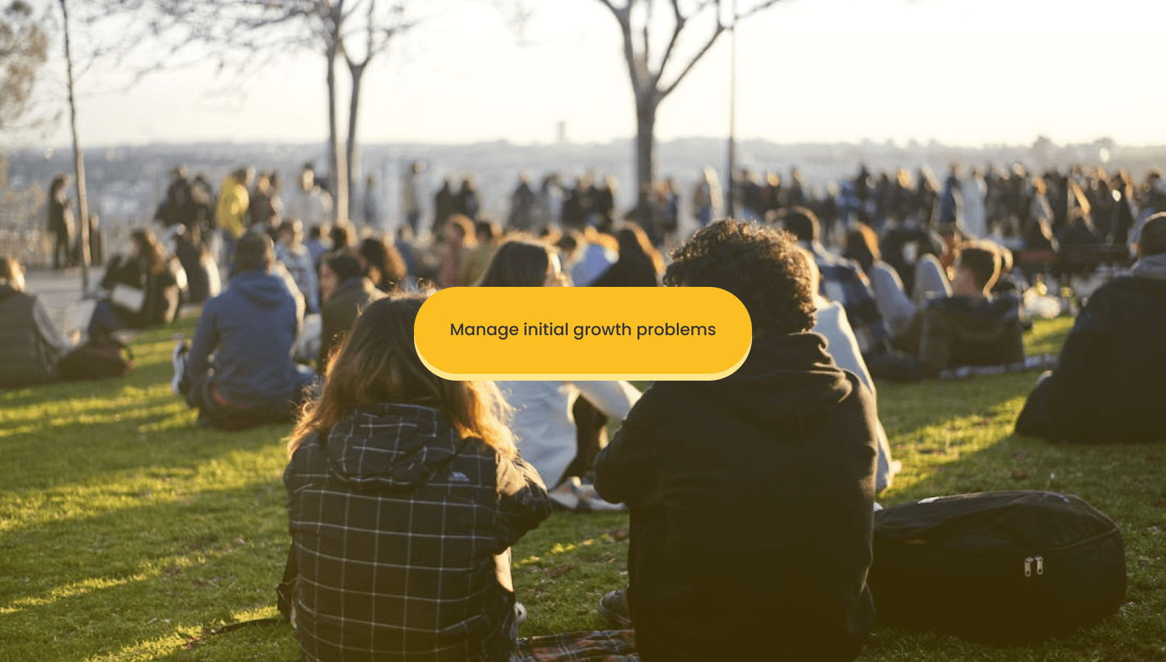 A community of people hanging out in an open field.