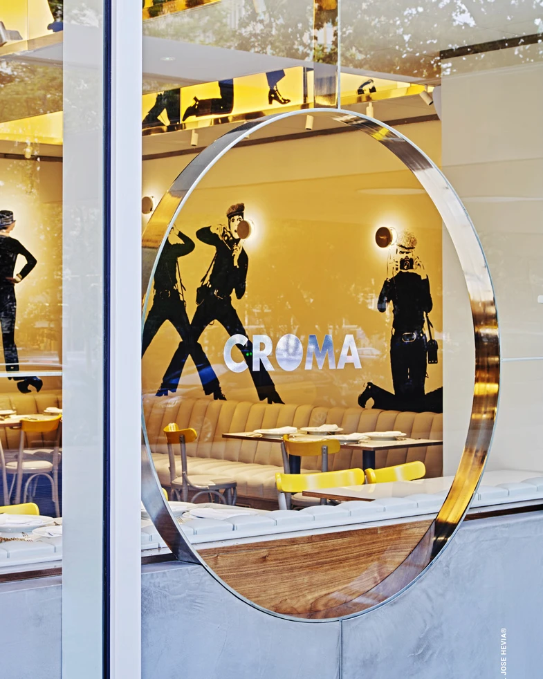 Croma logo on the round glass window of the restaurant, brand identity design by Sebastian Saavedra