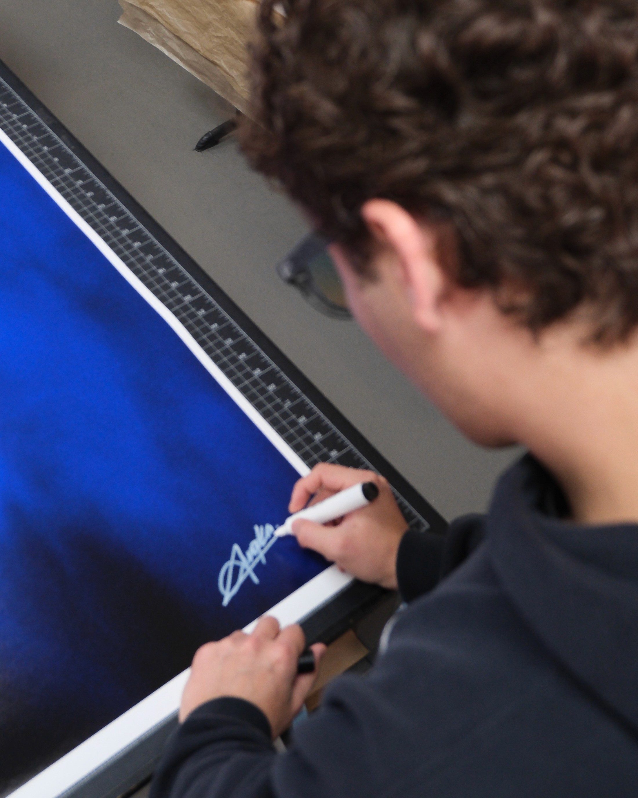 Artist standing and painting