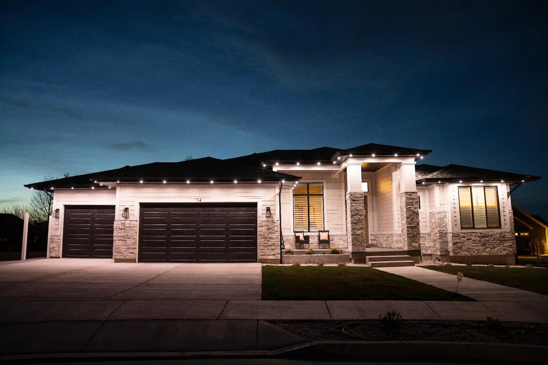 Warm LED eave lighting on upscale home